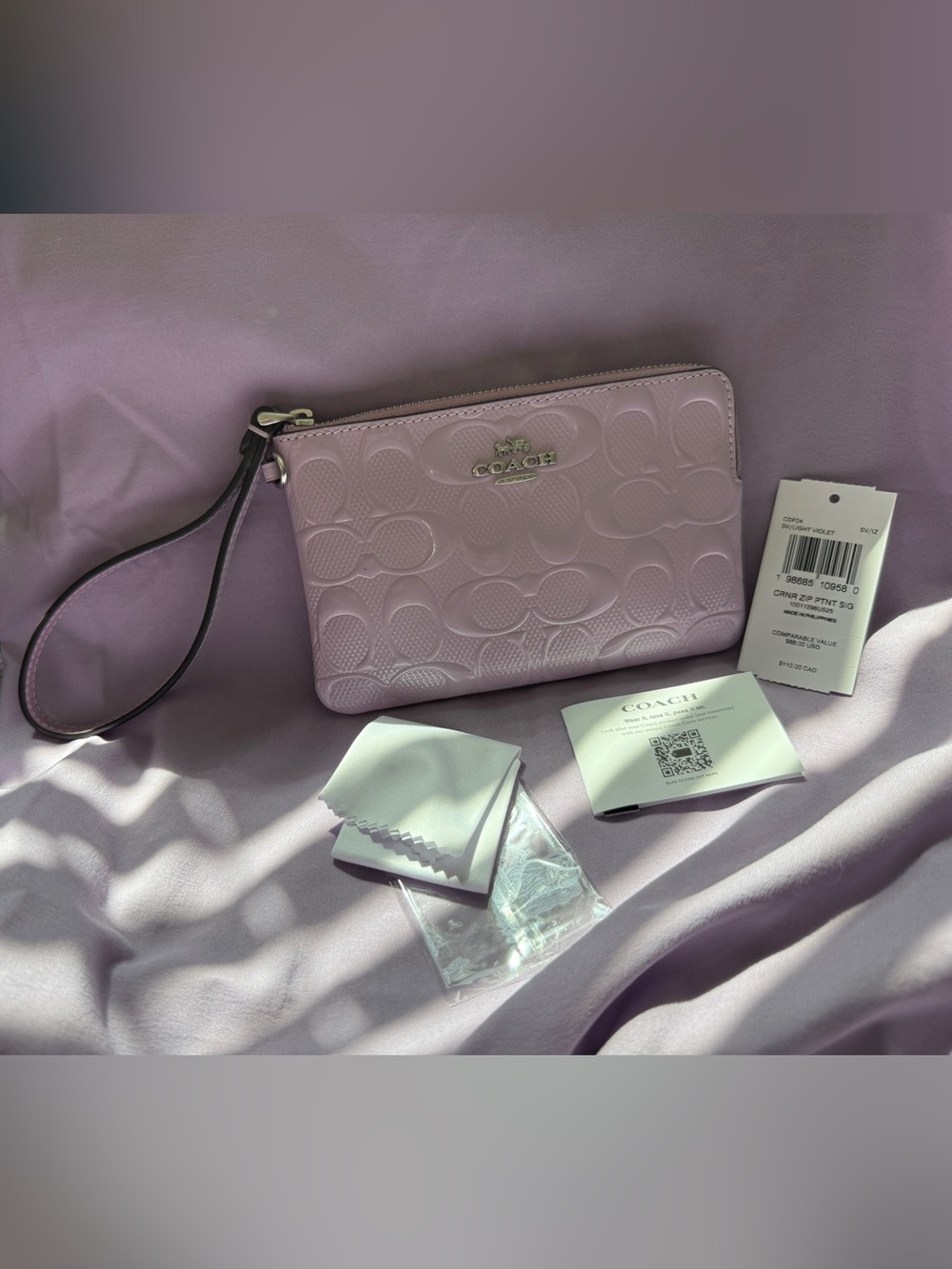 Coach NWT Signature Embossed Wristlet Violet